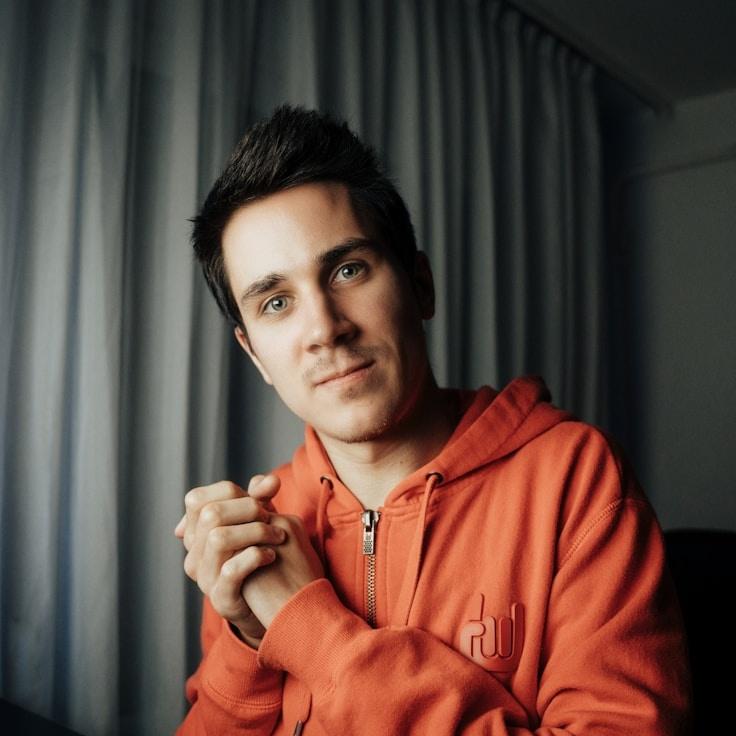 Kaveri Mehta, Lead Design Curator at RidgeTrailQuartz, reviewing corporate floral arrangements